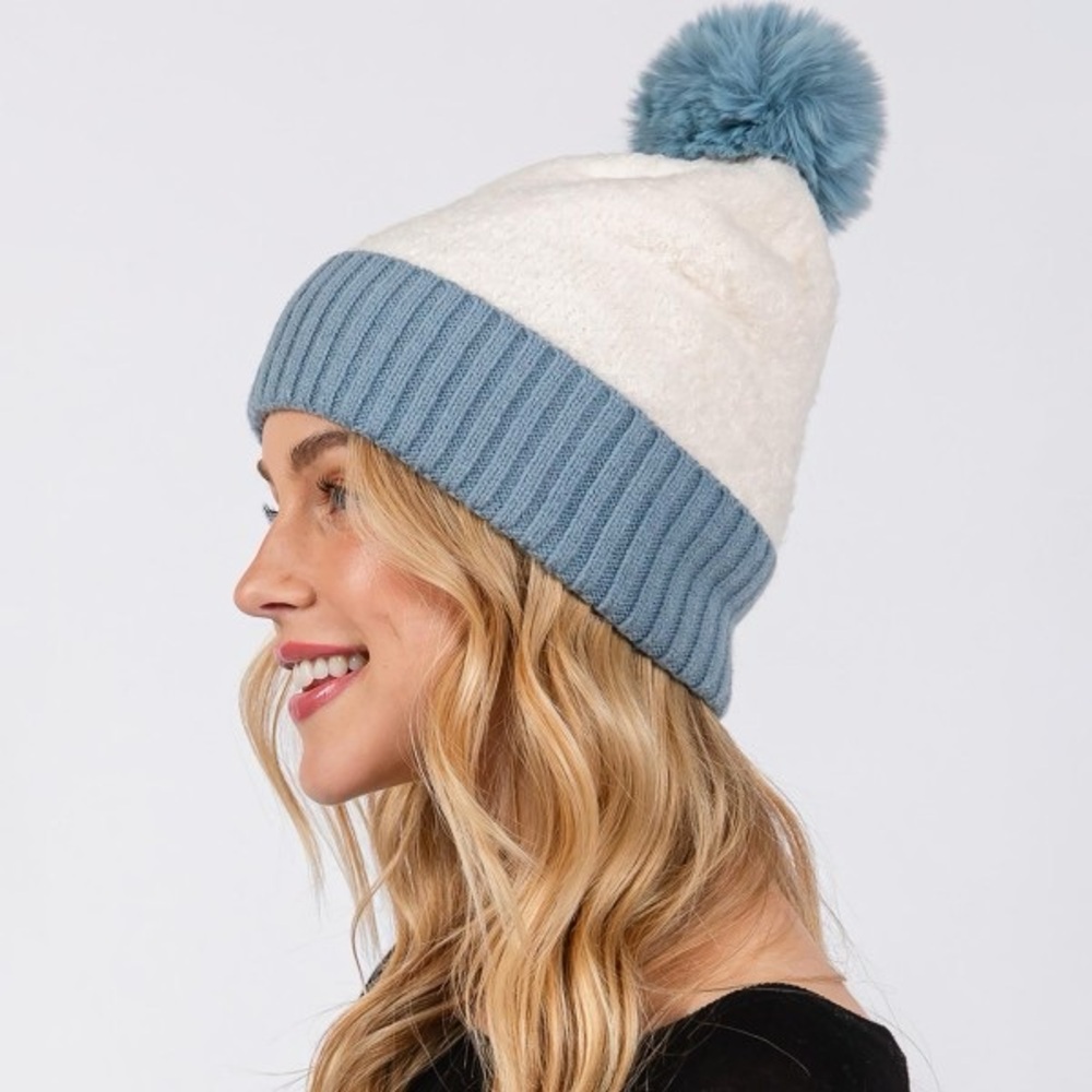 New cuffed Sherpa beanie with faux fur pom. 100% polyester
